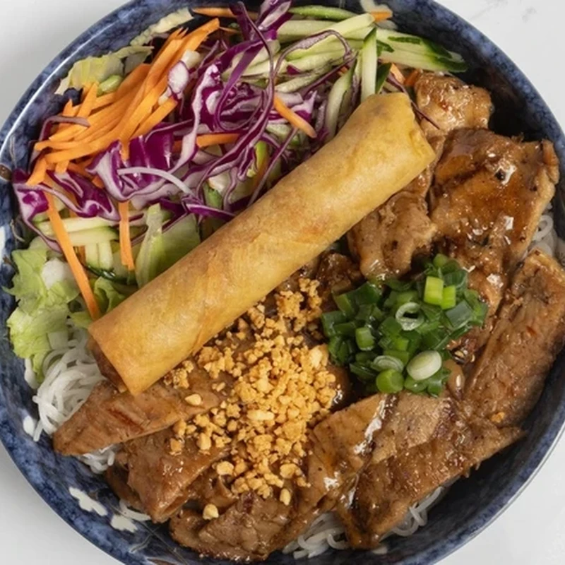 Grilled Pork noodle bowl with a fried pork spring roll and crushed peanuts at Bon Vietnamese Cuisine, Redstone, Calgary